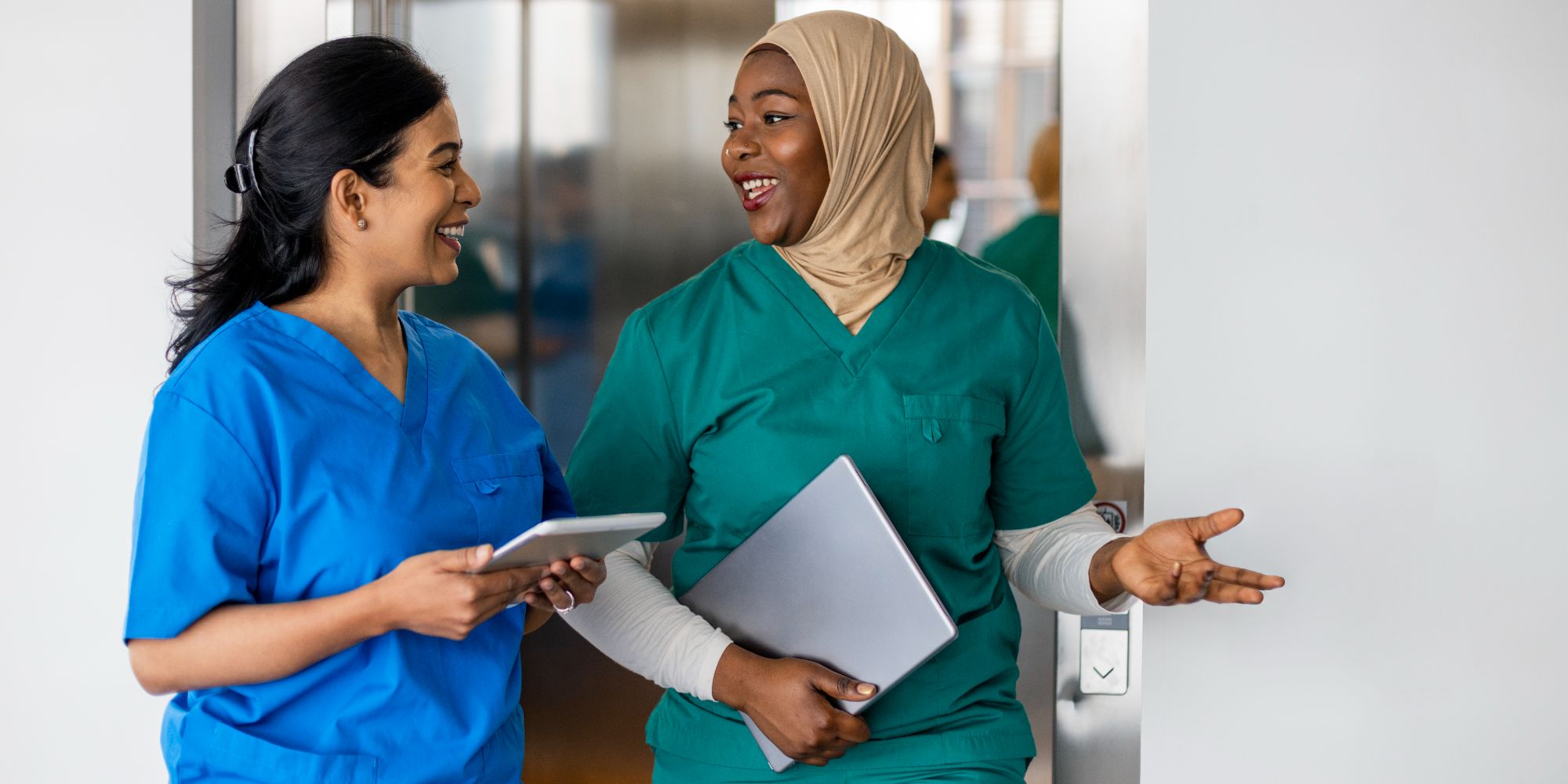 Two physicians speaking to each other